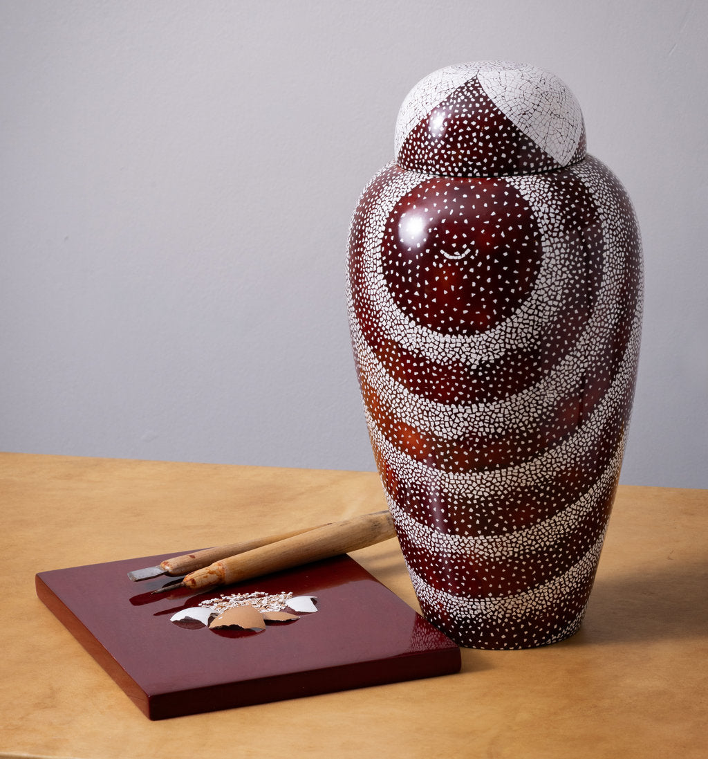 Artisan applying lacquer by hand at Stocker Studio